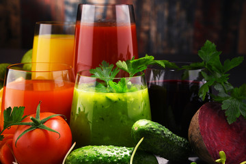 Glasses with fresh organic vegetable and fruit juices