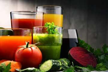 Glasses with fresh organic vegetable and fruit juices