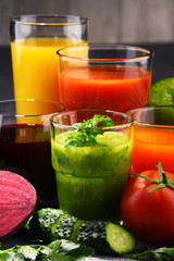 Glasses with fresh organic vegetable and fruit juices