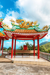 gazebo with a golden dragon on the roof of Chinese Sangthom Temple of the Goddess of Mercy Shrine in Chaloklum, Ko Pha Ngan, Thailand