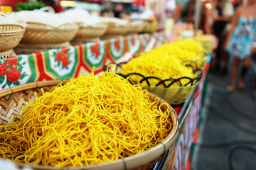Thai egg yellow noodle on street food Phantip market in Ko Pha Ngan, Thailand