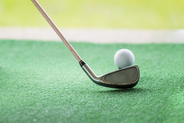 Golf ball on a green background at Golf clubs