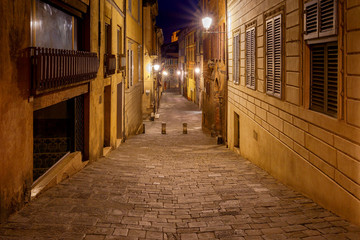 Siena. Old city street at night.