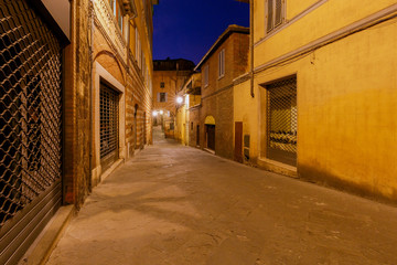 Obraz premium Siena. Old city street at night.