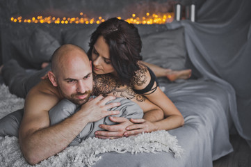 Girl tenderly kissing a bald man on the cheek 66.