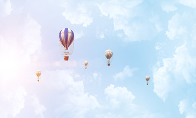 Flying hot air balloons in the air.