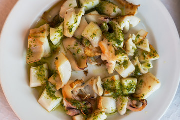 octopus with garlic, olive oil and parsley, typical Spanish food