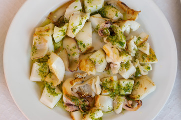 octopus with garlic, olive oil and parsley, typical Spanish food