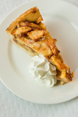 Apple and cinnamon cake with chantilly cream, top view