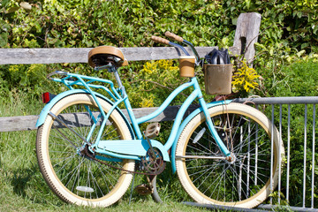 Vintage bicycle against rustic fence