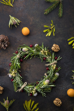Christmas wreath of rosemary on a beautiful brown background