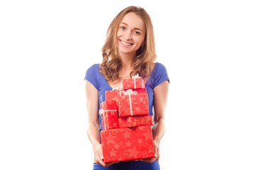 Young beautiful woman in hands holding a holiday gift