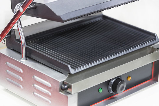 Electric grill for cooking food on a white background
