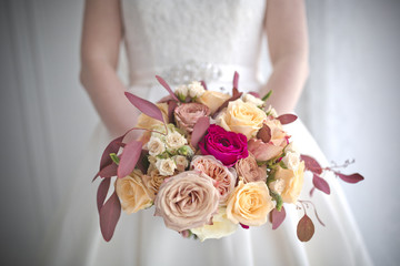 beautiful wedding bouquet in the hands of the bride. close-up