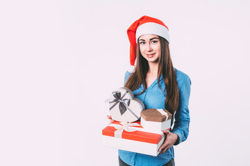 Smiling woman with gifts for New year and Christmas.