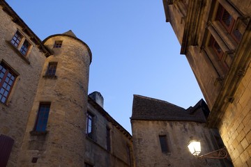 Fototapeta na wymiar Sarlat village with its towers and a lamppost, France