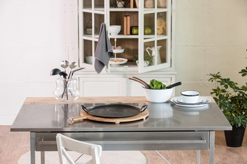 kitchen accessory on the metal table with kitchen cupboard in the home