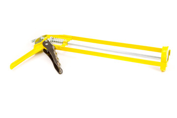 Yellow and black glue gun cut out on a white background.