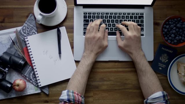 Top View Of Man Browsing The Internet, Preparing For Travel - Shot On Red Scarlet-W Dragon In 4K
