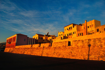 The walls of the old town of Chania are colored by the sunrise, Crete Greece