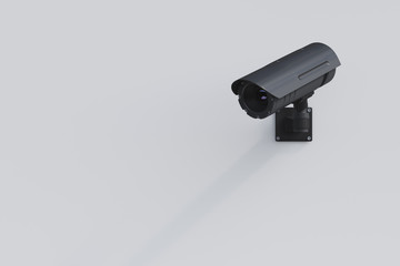 Black CCTV camera on a white wall