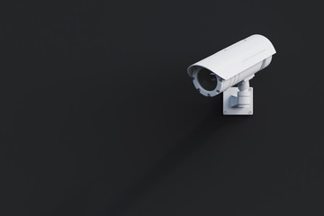 White CCTV camera on a black wall