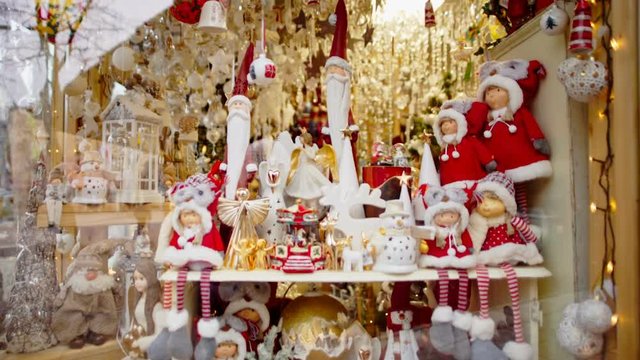 Vertical Panorama of Beautiful Showcase with Christmas Ornaments and Baubles: balls, bells, lantern, snowmen, santa, angels, stars etc