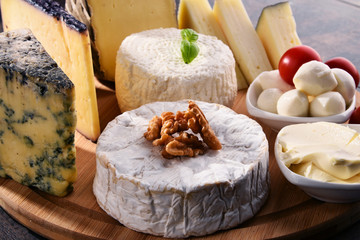Different sorts of cheese on kitchen table