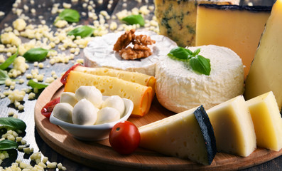 Different sorts of cheese on kitchen table