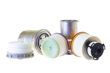 A composition of fuel filters for a diesel engine on a gray background. Horizontal image