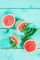 Alcohol drink, Rosemary, Grapefruit & Gin Cocktail, On light blue wooden table background, copy space top view