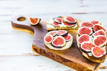 Healthy crackers and toast with figs and ricotta cheese