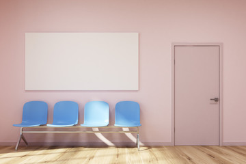 Pink waiting room, blue chairs, poster