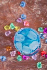 Colourful cocktails with ice on the beach in the hot summer