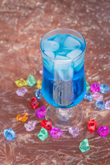Colourful cocktails with ice on the beach in the hot summer