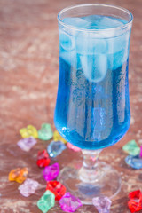 Colourful cocktails with ice on the beach in the hot summer