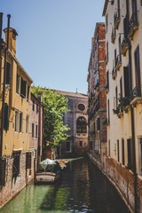 Venice cityscape, narrow water canal, bridge and traditional buildings. Italy