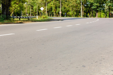 Fototapeta na wymiar Empty asphalt road with white markings