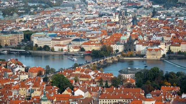 Aerial timelapse view of the Old Town architecture with red roofs in Prague , Czech Republic. Vltava river. Prague Charles bridge old town panorama. Time lapse.