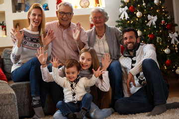 Fototapeta na wymiar Children with parents and grandparents celebrating Christmas