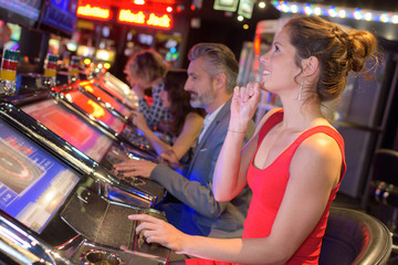 young group of people gambling in a casino