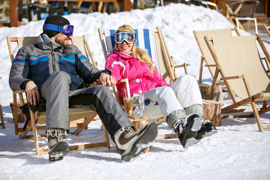 Couple enjoy at sun on ski terrain