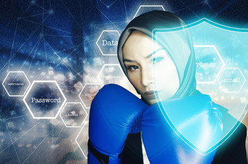 Cyber security concept, aggressive face expression young women with boxing glove over abstract background and shield protection