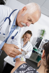 Fototapeta premium doctor administering a vaccine