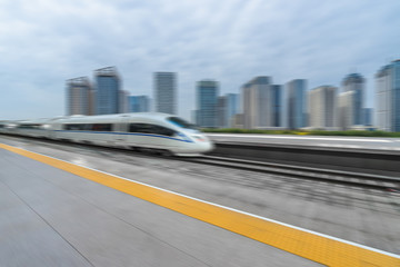 very high-speed train go through the financial center, china.