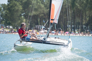 Obraz premium enjoying extreme sailing with racing sailboat