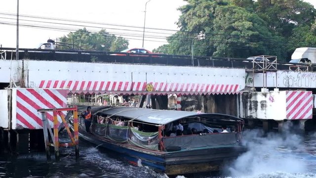 BANGKOK, THAILAND - November 14: Saen Saeb express boat taking passengers to the next station along the canal towards the Chao Phraya river in Bangkok, Thailand on November, 2017.