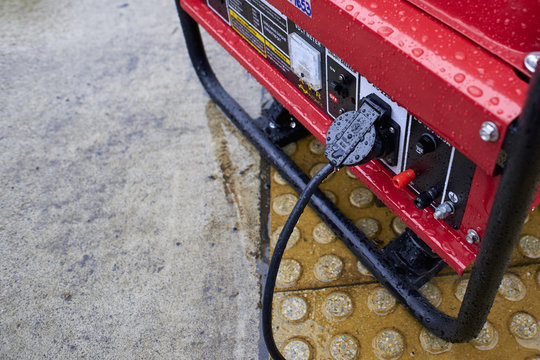 Electric generator, used in the rain on the ground. Fuel motor
