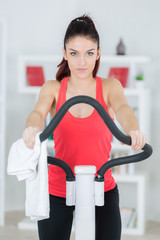 young woman on the exercise machine
