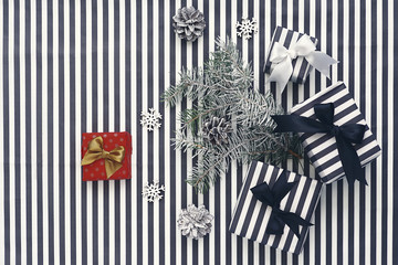 Top view. Black and white gift boxes on a  striped background
